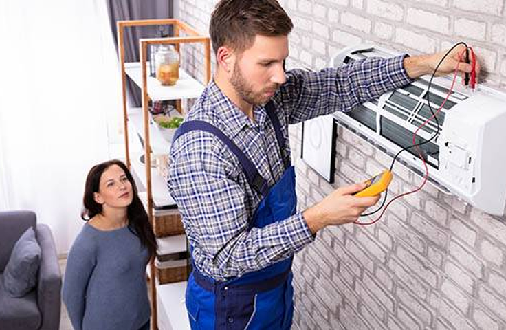 A tech working on an hvac system
