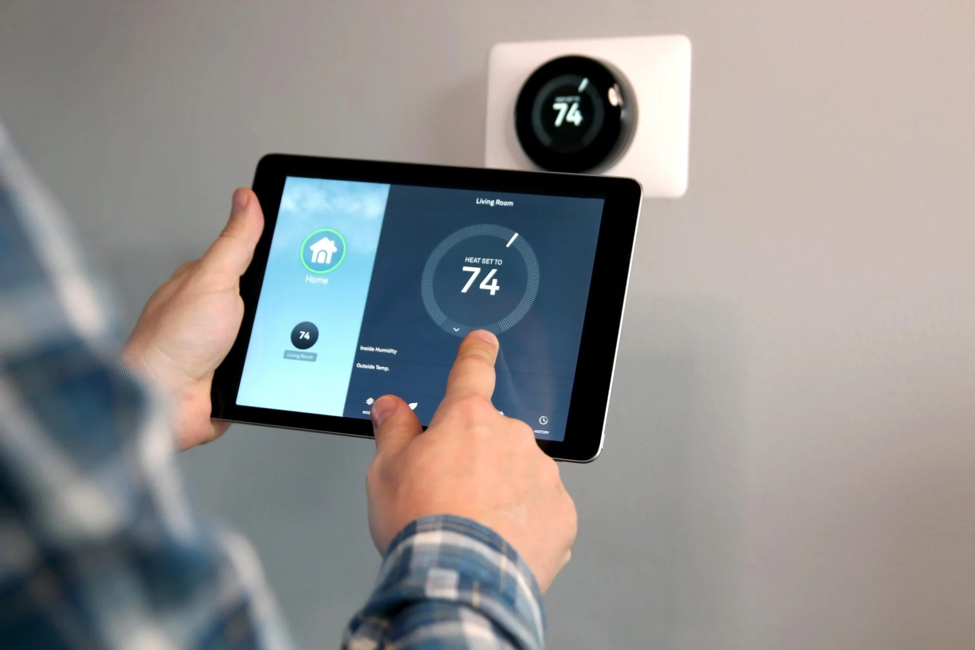 Adjusting a smart thermostat with a tablet